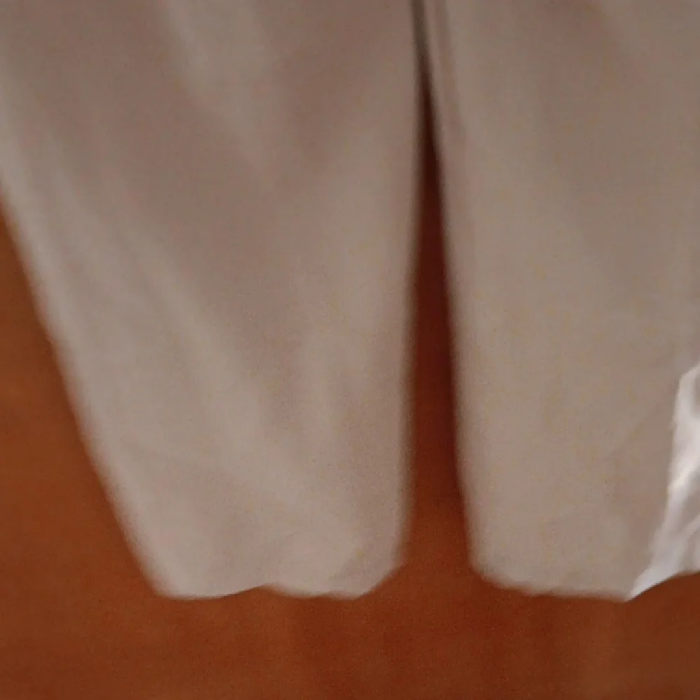 Lioness Chic Tan Jumpsuit with Wide Legs and Sleeveless Design - Picture 5 of 5